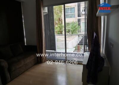 Living room with sofa and balcony view