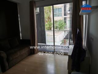 Living room with sofa and balcony view