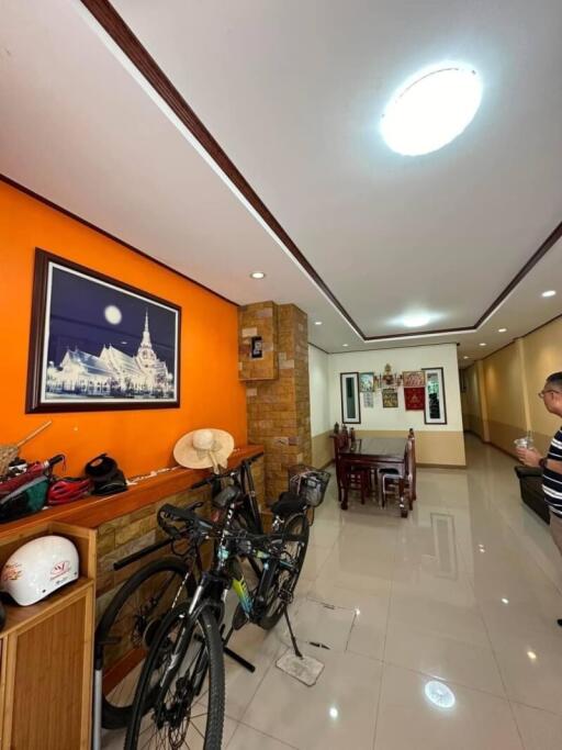 Modern living room with dining area and bicycle storage