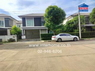 Modern suburban house with car parked outside