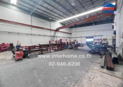 Industrial warehouse interior with machinery and metal structures