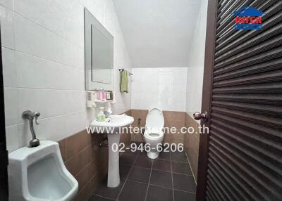 Bathroom with sink, toilet, and urinal