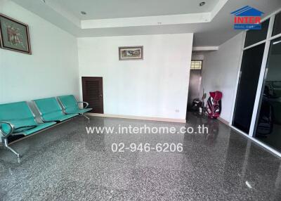 Spacious main living area with tiled flooring and ample lighting