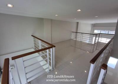 Spacious open loft area with railing