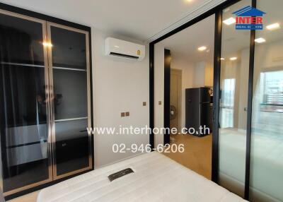 Modern bedroom with sliding glass door and air conditioning