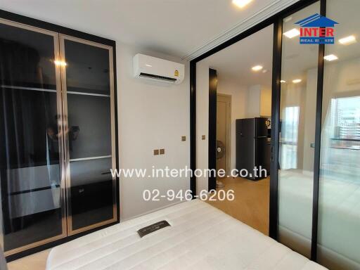 Modern bedroom with sliding glass door and air conditioning