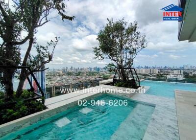 Rooftop swimming pool with a city view