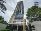 High-rise apartment building with signage