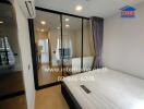 Bedroom with glass door and balcony view