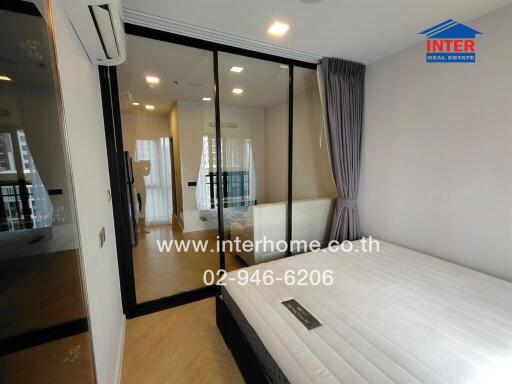 Bedroom with glass door and balcony view