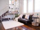 Modern living room with staircase and bookshelf