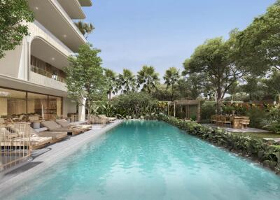 Outdoor pool area with lush greenery and seating