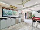 Modern kitchen with bar seating and open living area