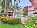 Outdoor area with a pool and garden at a residential property