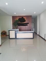 reception area with desk and plant