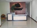 reception area with desk and plant