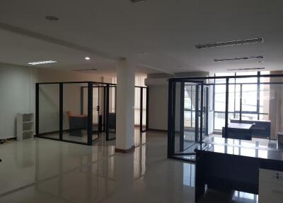 Spacious office space with glass cubicles