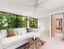 Spacious living room with large windows and modern decor