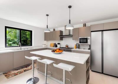 Modern kitchen with sleek appliances and white cabinets