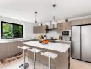 Modern kitchen with sleek appliances and white cabinets