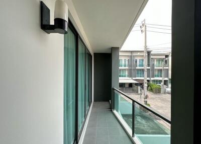 Modern balcony with glass railing and flooring