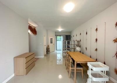 Dining area with wooden table and chairs