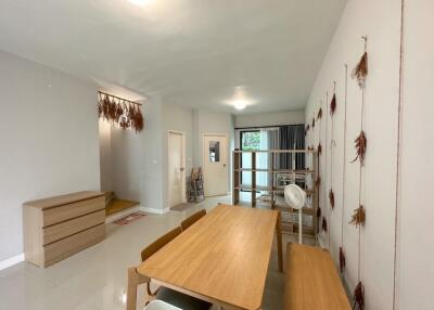 Dining area with table and chairs, and minimalistic decor