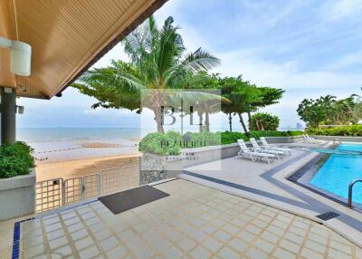 Beachfront patio with pool and lounge chairs