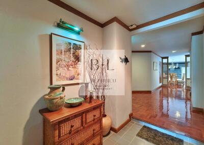 House entrance with decorative items and a view of the dining area