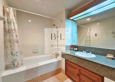 Modern bathroom with bathtub and vanity area