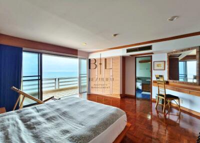 Spacious bedroom with ocean view and balcony