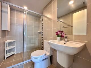 Modern bathroom with shower, toilet, and sink