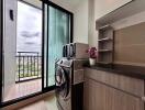 Modern laundry room with city view and balcony