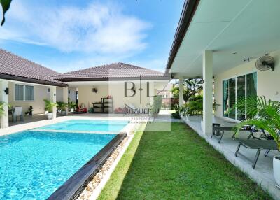 Outdoor area with swimming pool and garden