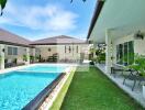 Outdoor area with swimming pool and garden