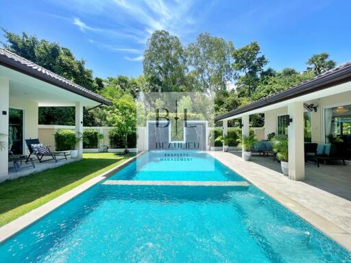 Outdoor pool area with adjacent buildings