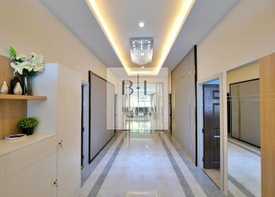 Modern hallway with decorative lighting and polished flooring