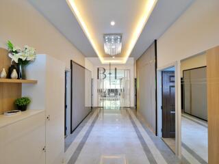 Modern hallway with decorative lighting and polished flooring