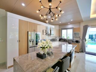 Modern kitchen with a large island and stylish lighting