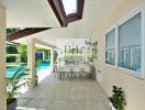 Spacious patio with dining area by the pool