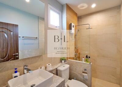 Modern bathroom with vanity and shower area