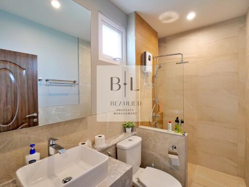 Modern bathroom with vanity and shower area