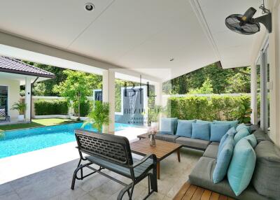 Outdoor seating area with pool view