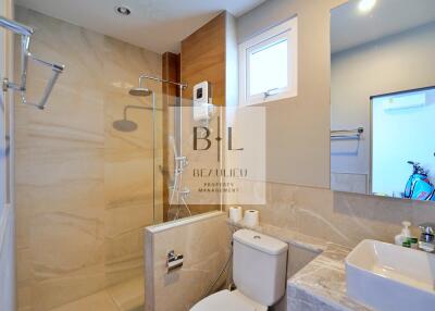 Modern bathroom with glass-enclosed shower