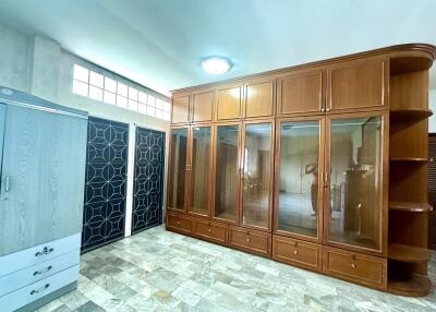 Bedroom with large wooden wardrobe