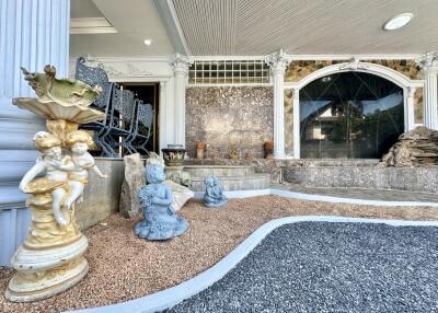 Entrance with decorative statues and columns