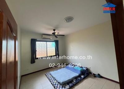 Bedroom with a mattress on the floor, ceiling fan, window with curtains, and tiled floor