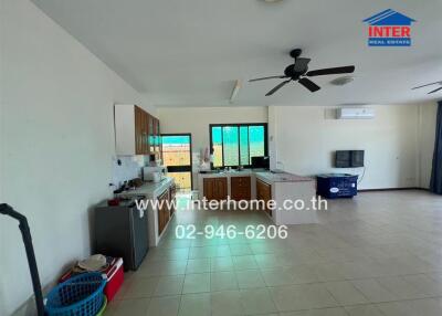 Spacious kitchen with modern appliances and ample natural light