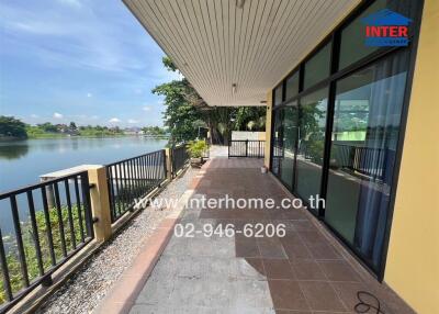 Spacious outdoor balcony with scenic water view