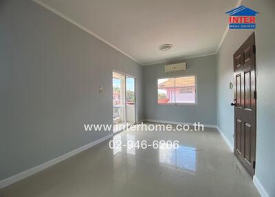 Bright living room with large windows and balcony access